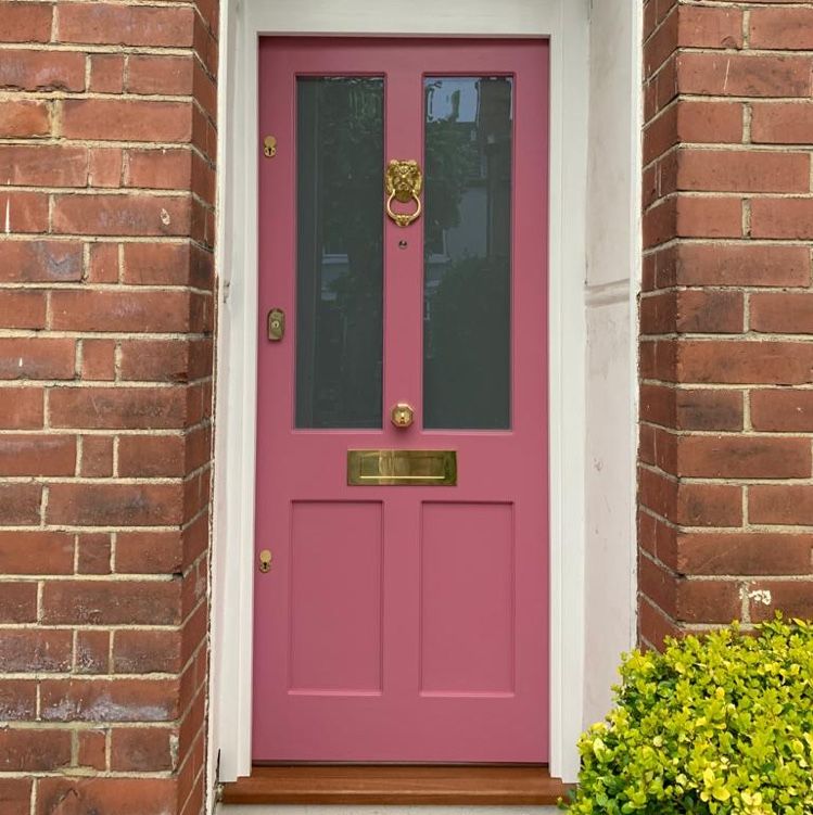 Pink front door with glass panels