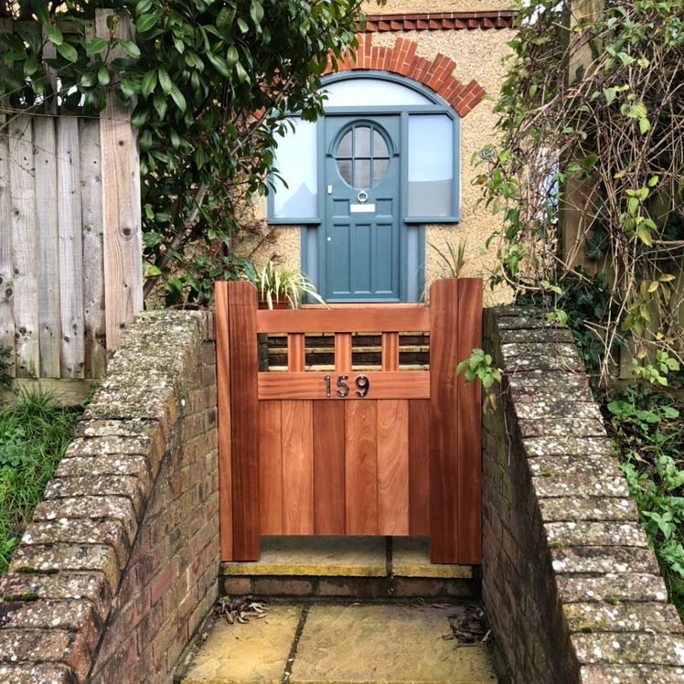 Hardwood gate with house number